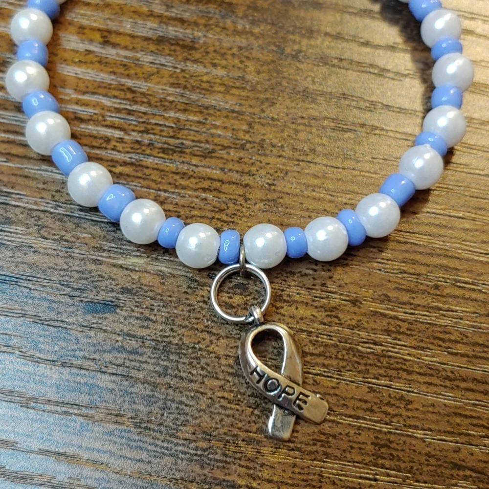 Handmade beaded bracelet w/cancer awareness charm